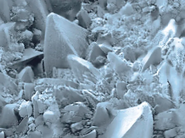 Magnified view of rough, uneven stainless steel surface before TiN coating