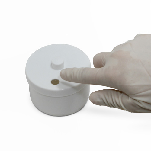 Ejecting burs directly into Banicide® Cold Sterilization Tray lid port for safe, touch-free handling