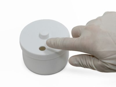 Ejecting burs directly into Banicide® Cold Sterilization Tray lid port for safe, touch-free handling